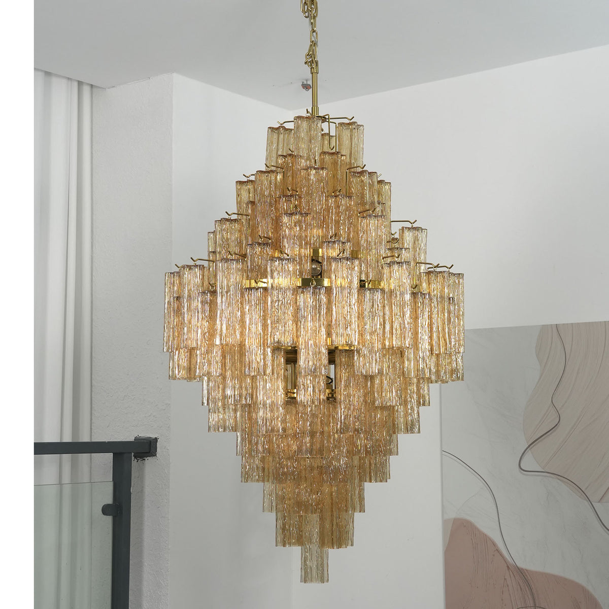 Close-up of amber glass tubes with rippled texture on the Addis Diamond Chandelier
