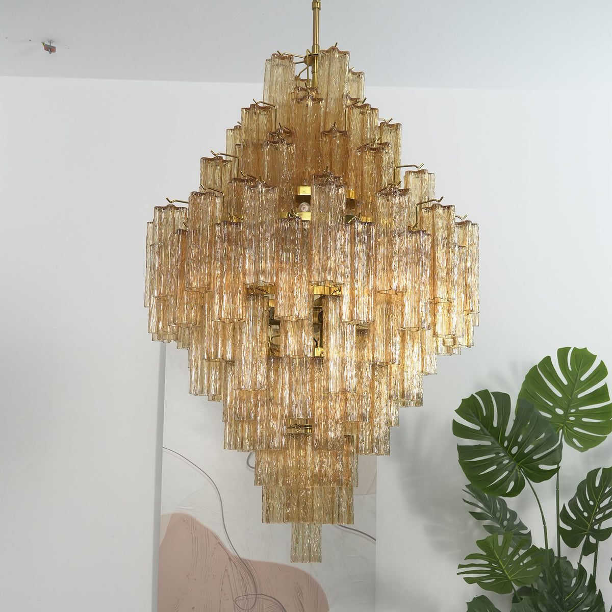 Close-up of amber glass tubes on Addis Diamond Chandelier showing textured rippled surface