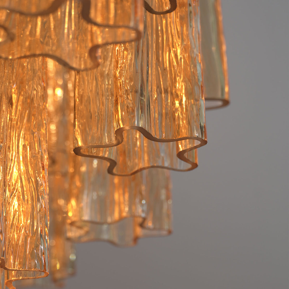 Close-up of the gold ceiling mount and hanging chain on the Addis Diamond Chandelier
