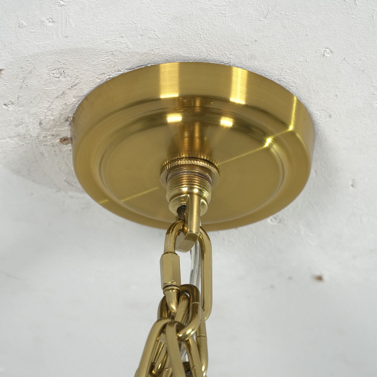 Close-up of pink glass tubes on the Addis Diamond Chandelier showing rippled texture