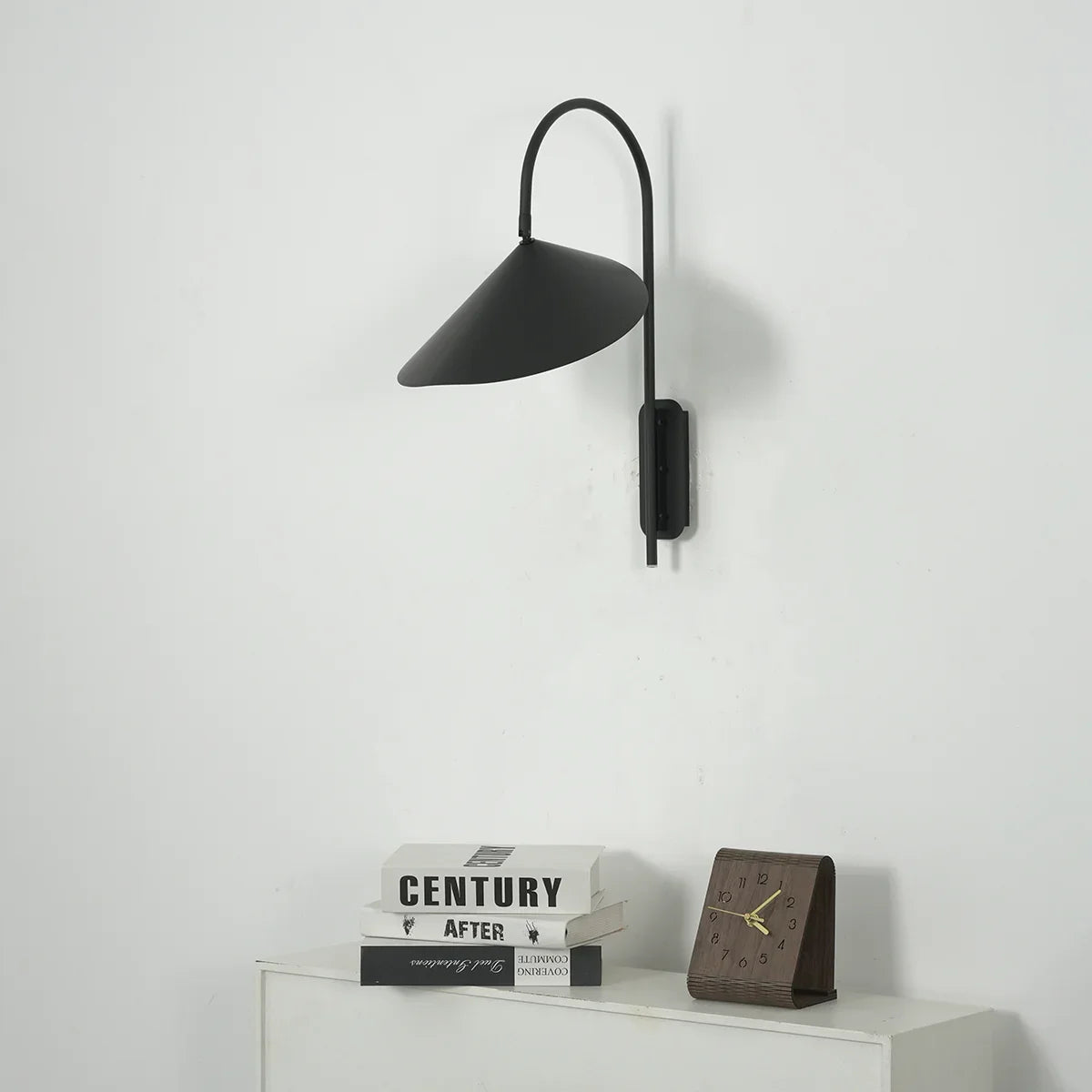 Close-up view of Arum Swivel Wall Lamp components, showing wall mount, swivel arm, and shade