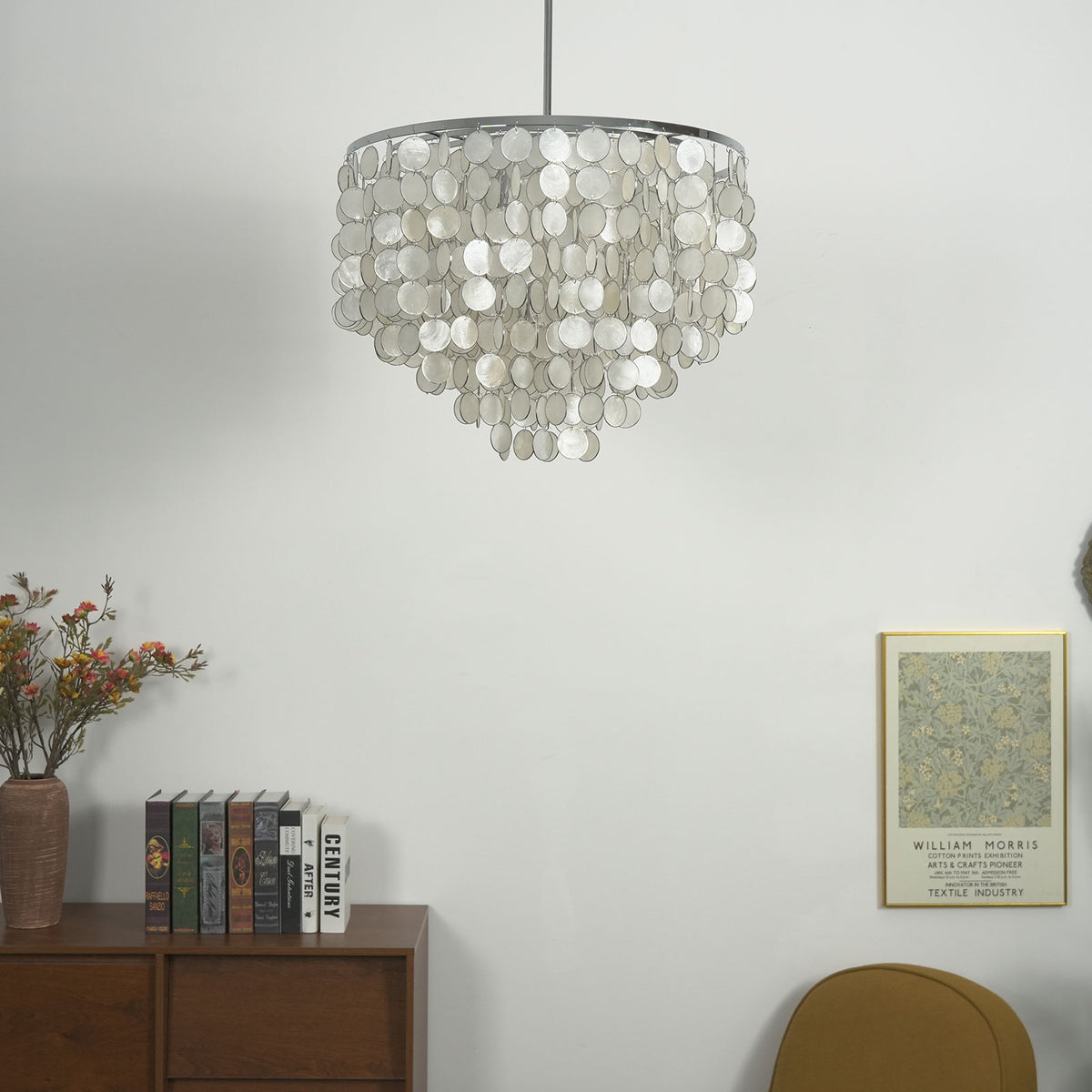Capiz shell round chandelier against a light neutral background, showing its soft cascading design.