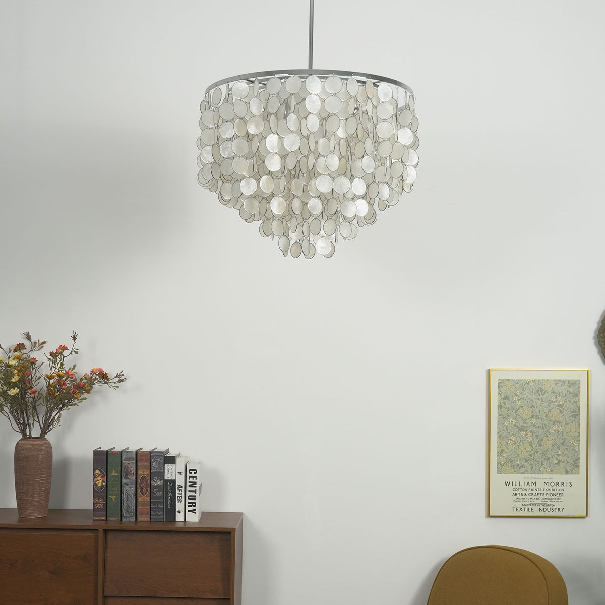 Capiz shell round chandelier in a styled room setting with neutral decor and soft lighting.