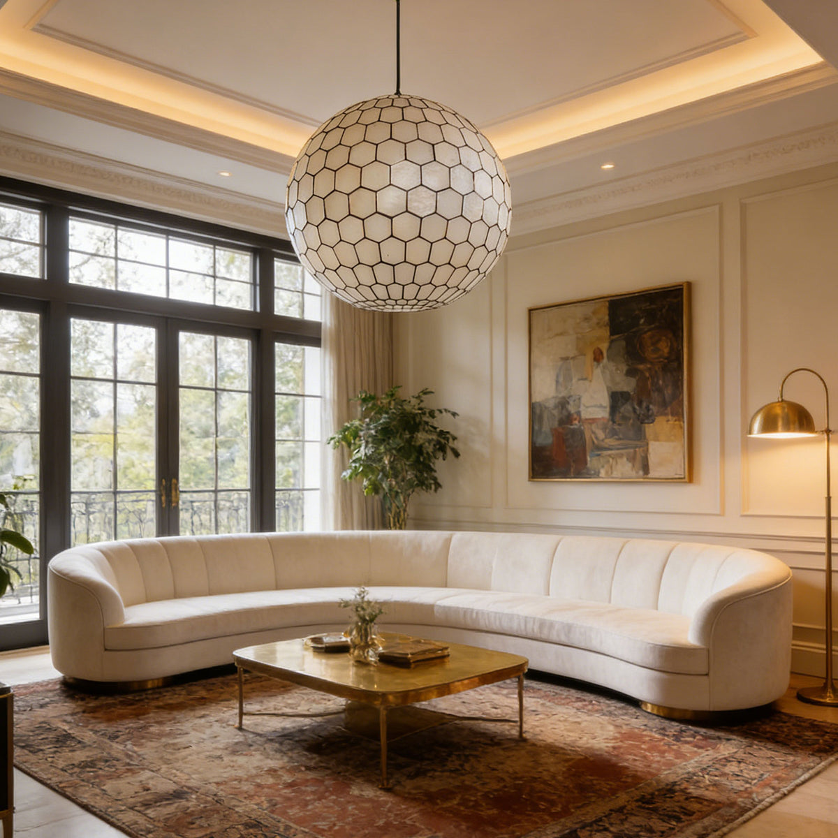 Coastal seashell globe pendant light illuminating a bright living room with a curved white sofa.
