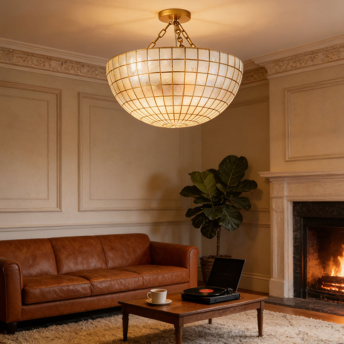 Gold grid capiz shell ceiling light in a living room with fireplace and warm ambient light Metavaya