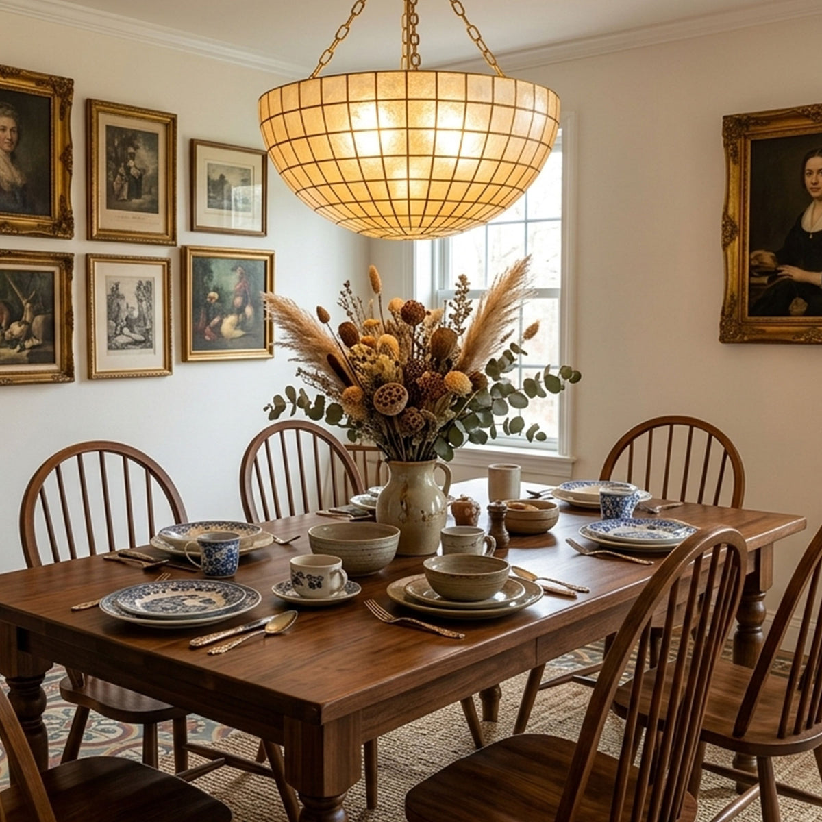 Gold grid capiz shell ceiling light above a wooden dining table in a traditional dining room Metavaya
