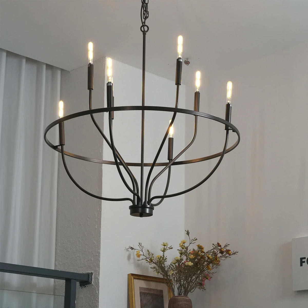 Greyson Bowl Chandelier side view in a minimalist room with framed art