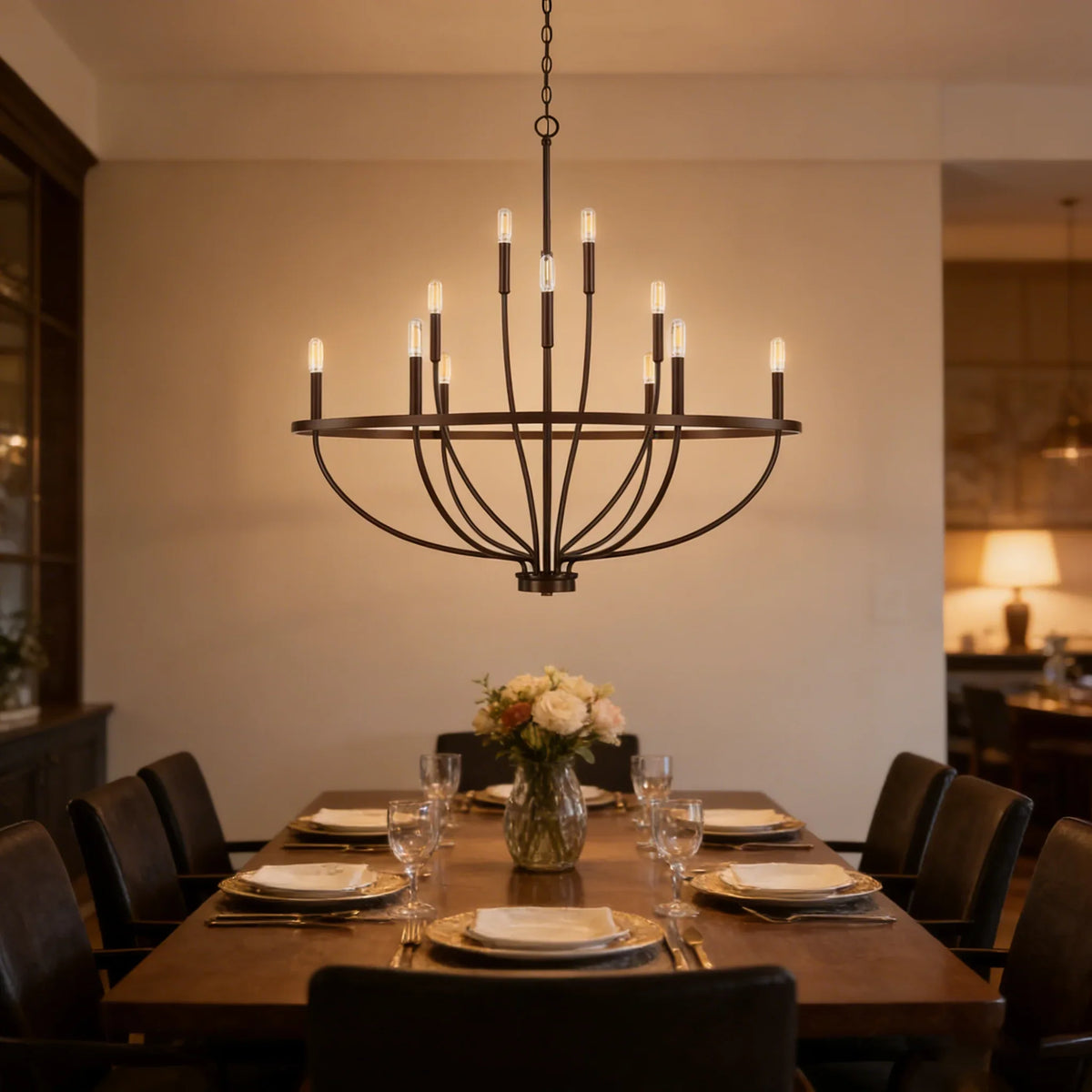 Greyson Bowl Chandelier above a formal dark wood dining table with place settings