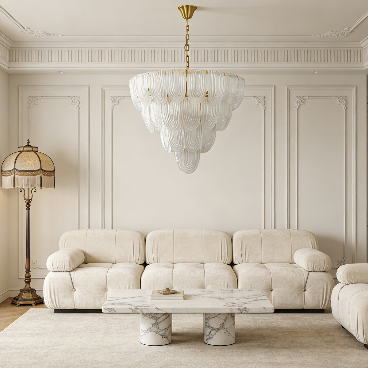 Layered glass petal chandelier in a bright living room with cream-colored sofas and classic decor.