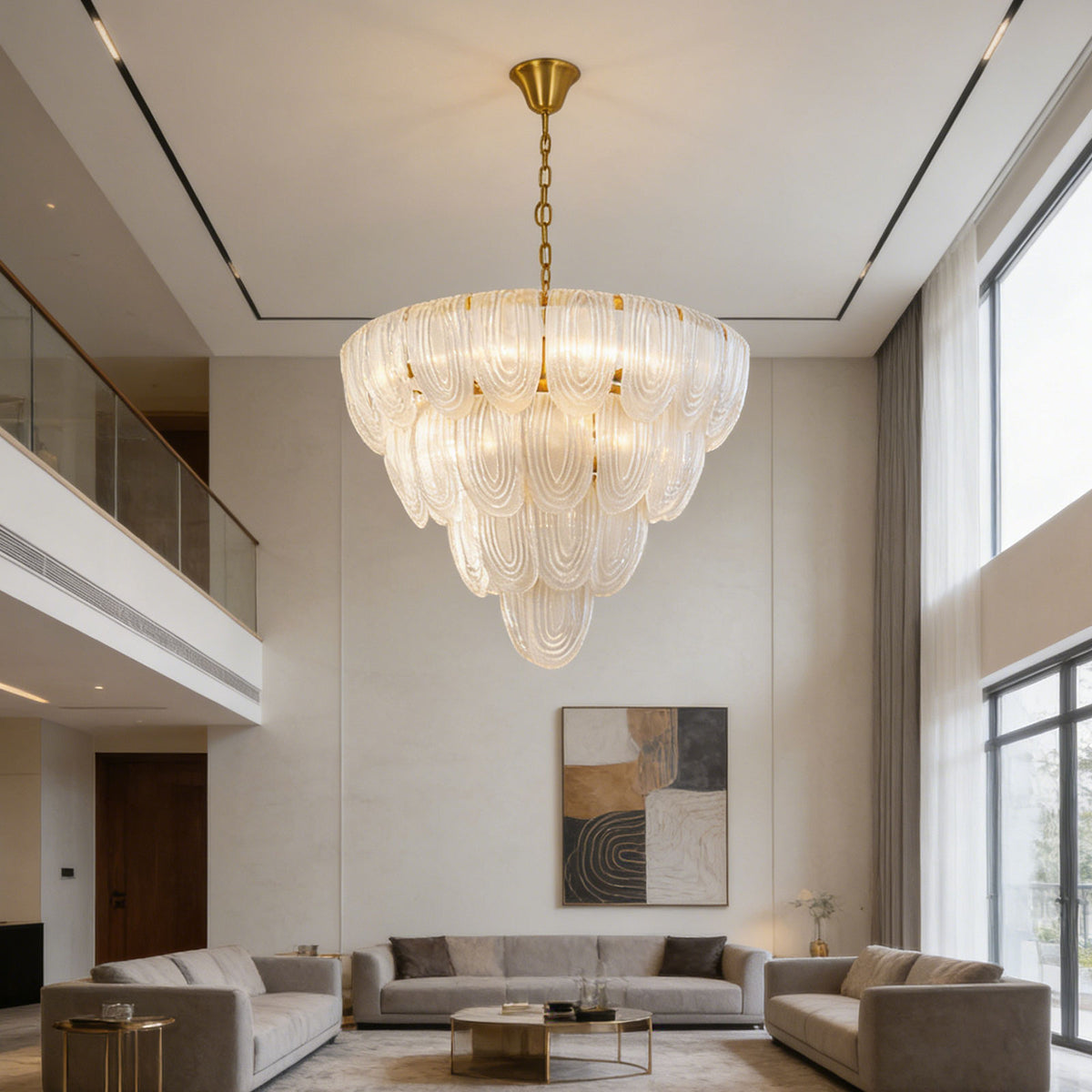 Layered glass petal chandelier in a high-ceiling modern living room with neutral sofas.