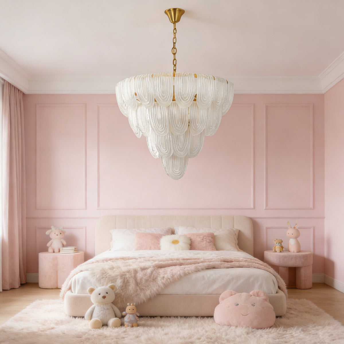 Layered glass petal chandelier hanging above a tufted bed in a soft pink modern bedroom.