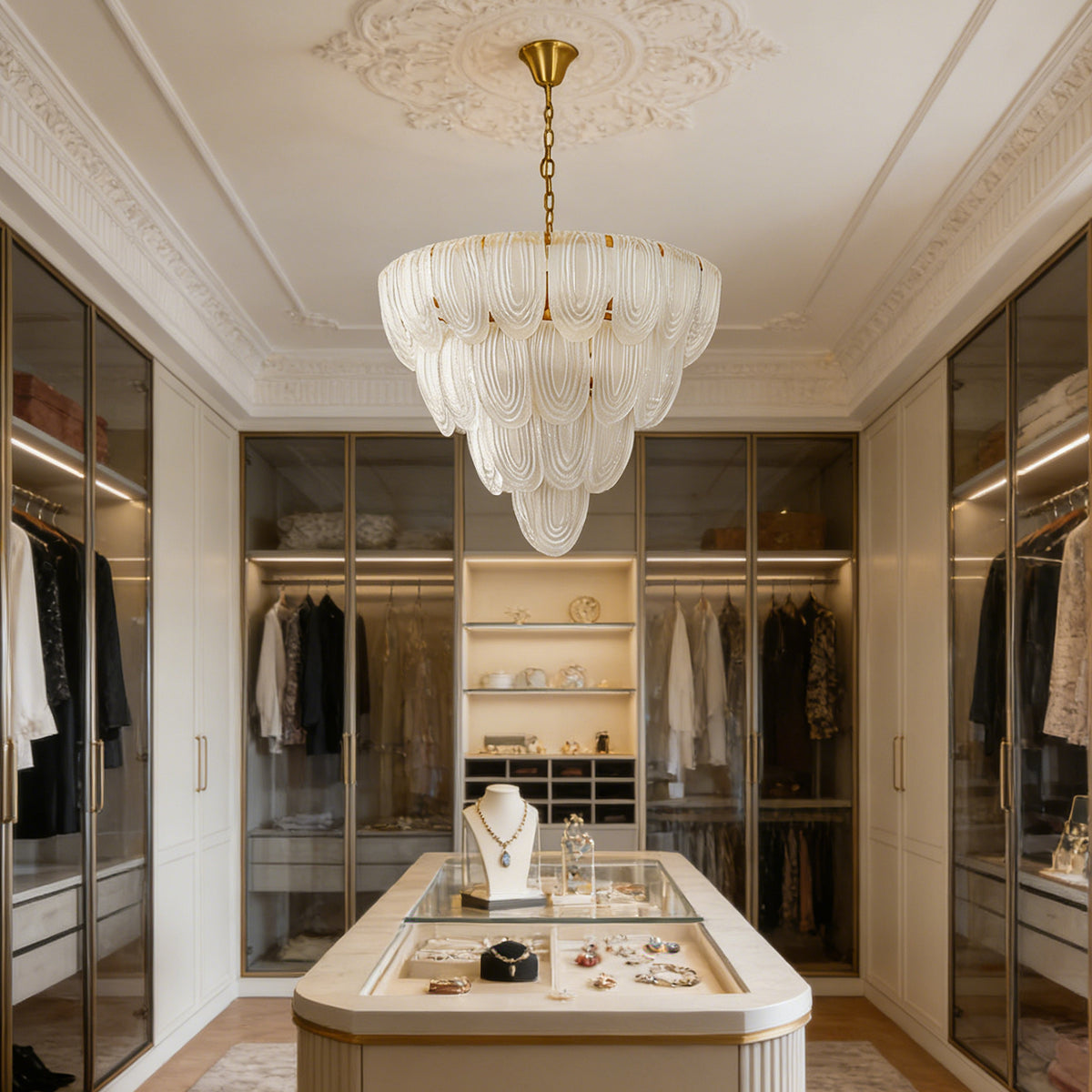 Layered glass petal chandelier in a bright walk-in closet with built-in cabinetry and a jewelry display.