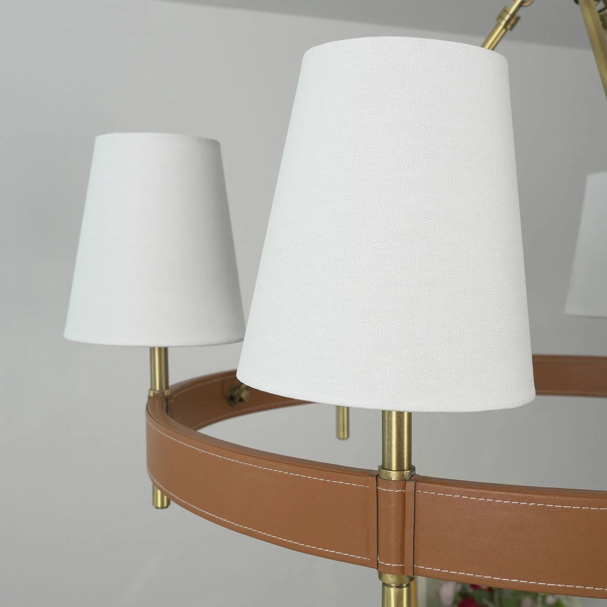 Leather Halo Ring Chandelier above a dining table in a light wood kitchen
