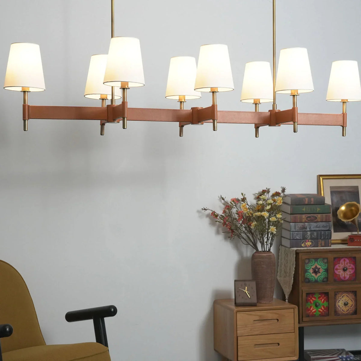 Large linear version of the Leather Halo Ring Chandelier in a modern room