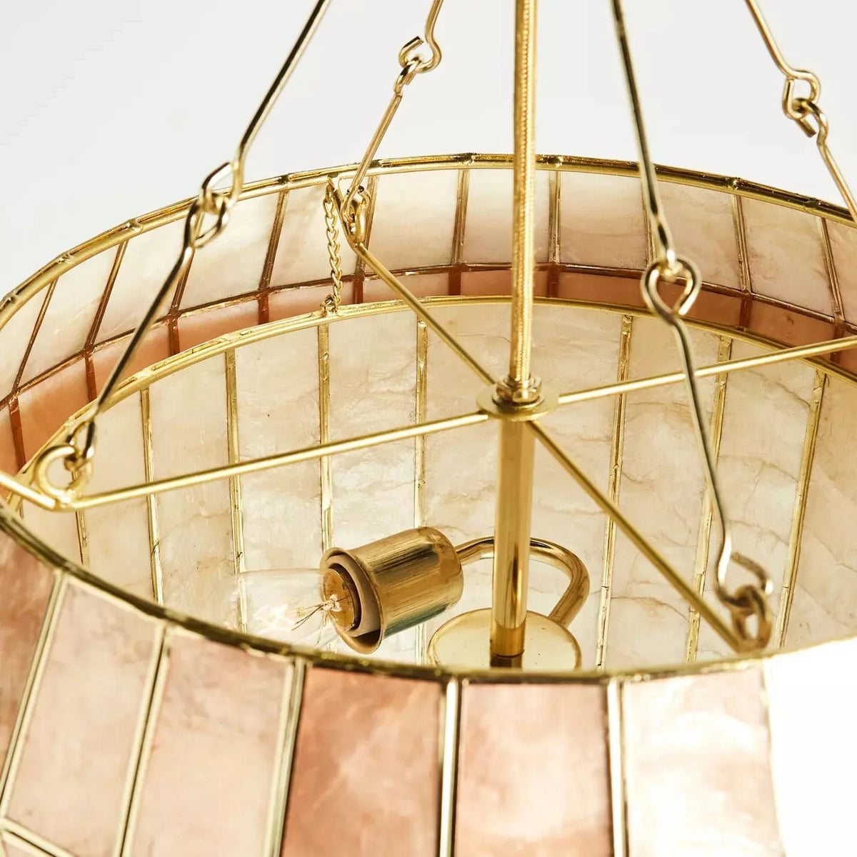 Close-up of the gold bulb holders inside the Light Luxury Shell Chandelier