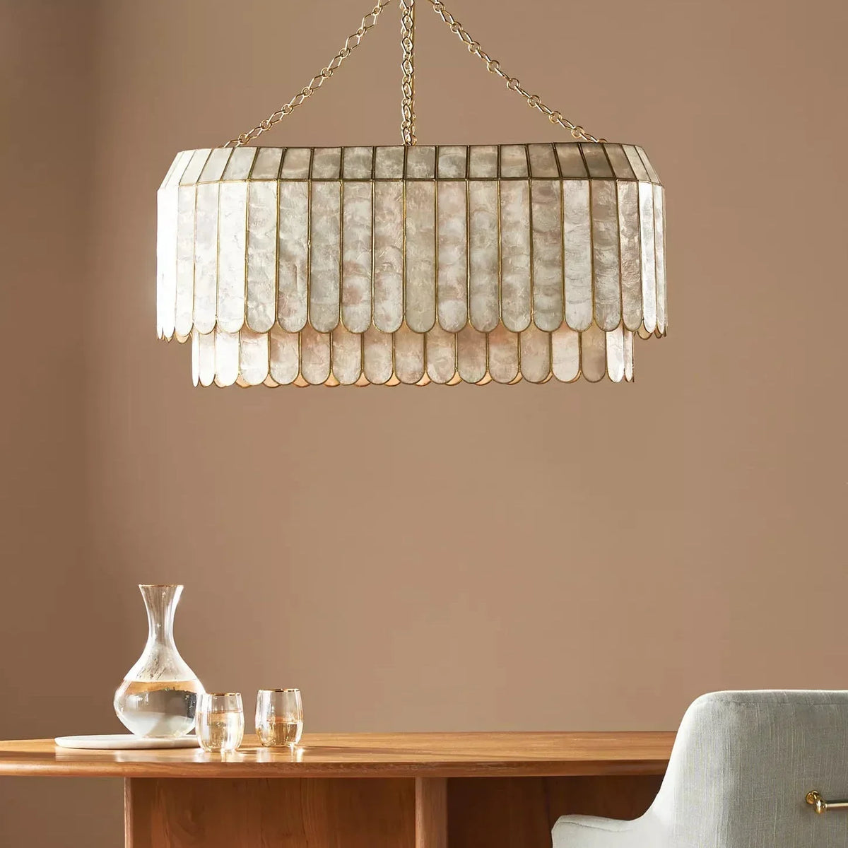 Light Luxury Shell Chandelier above a wooden desk in a modern home office