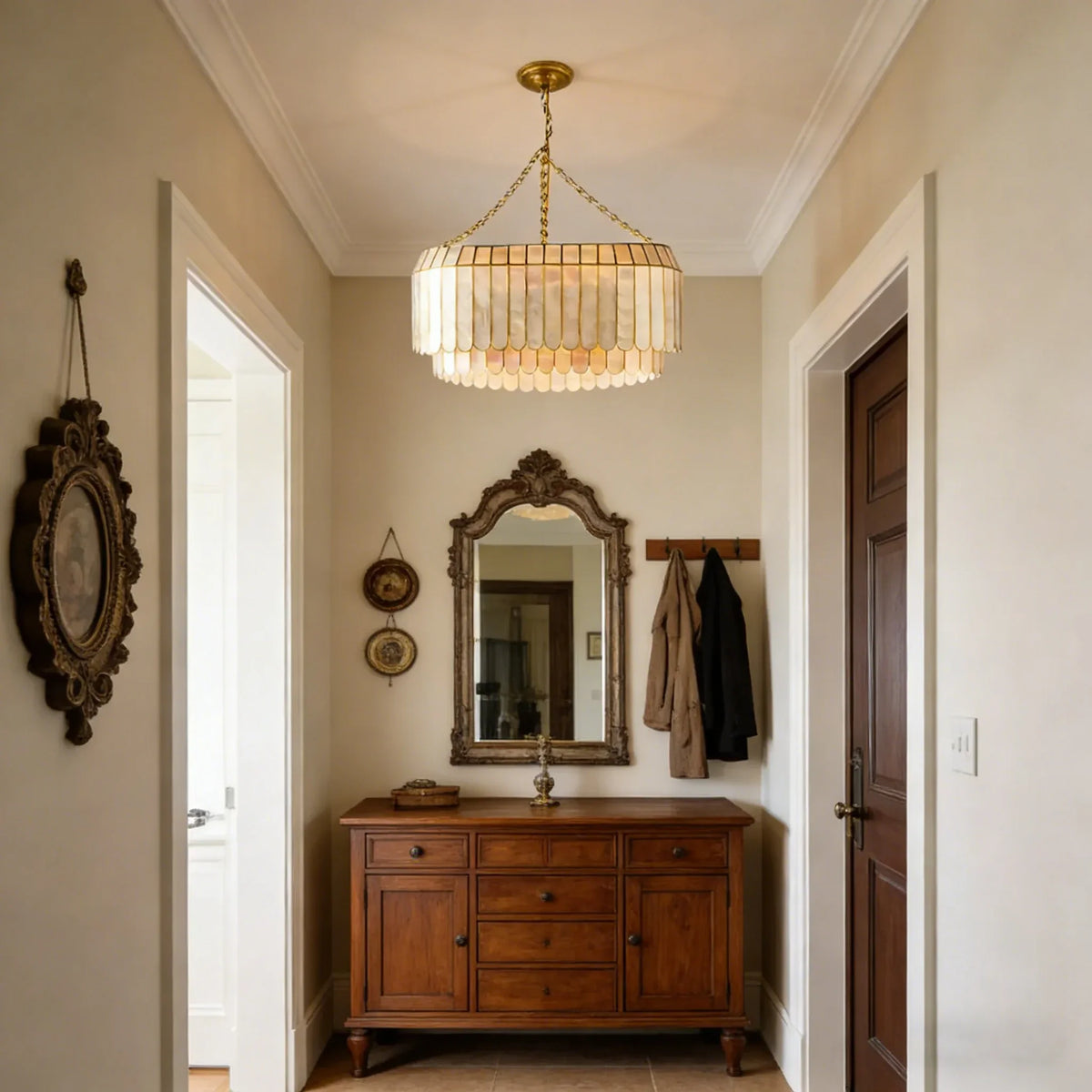 Light Luxury Shell Chandelier in a bright entryway with a wooden dresser and mirror