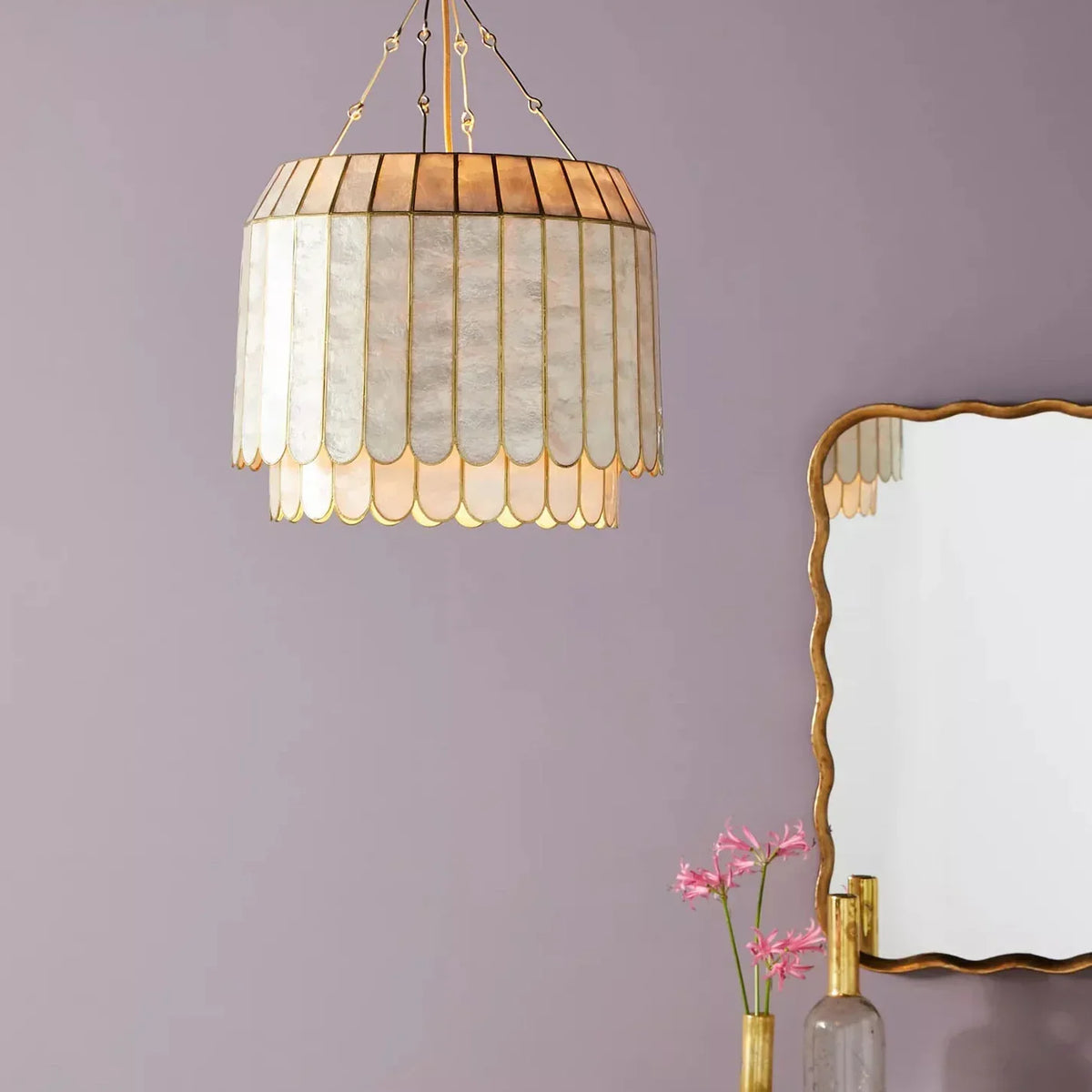 Light Luxury Shell Chandelier against a soft purple wall with a gold mirror
