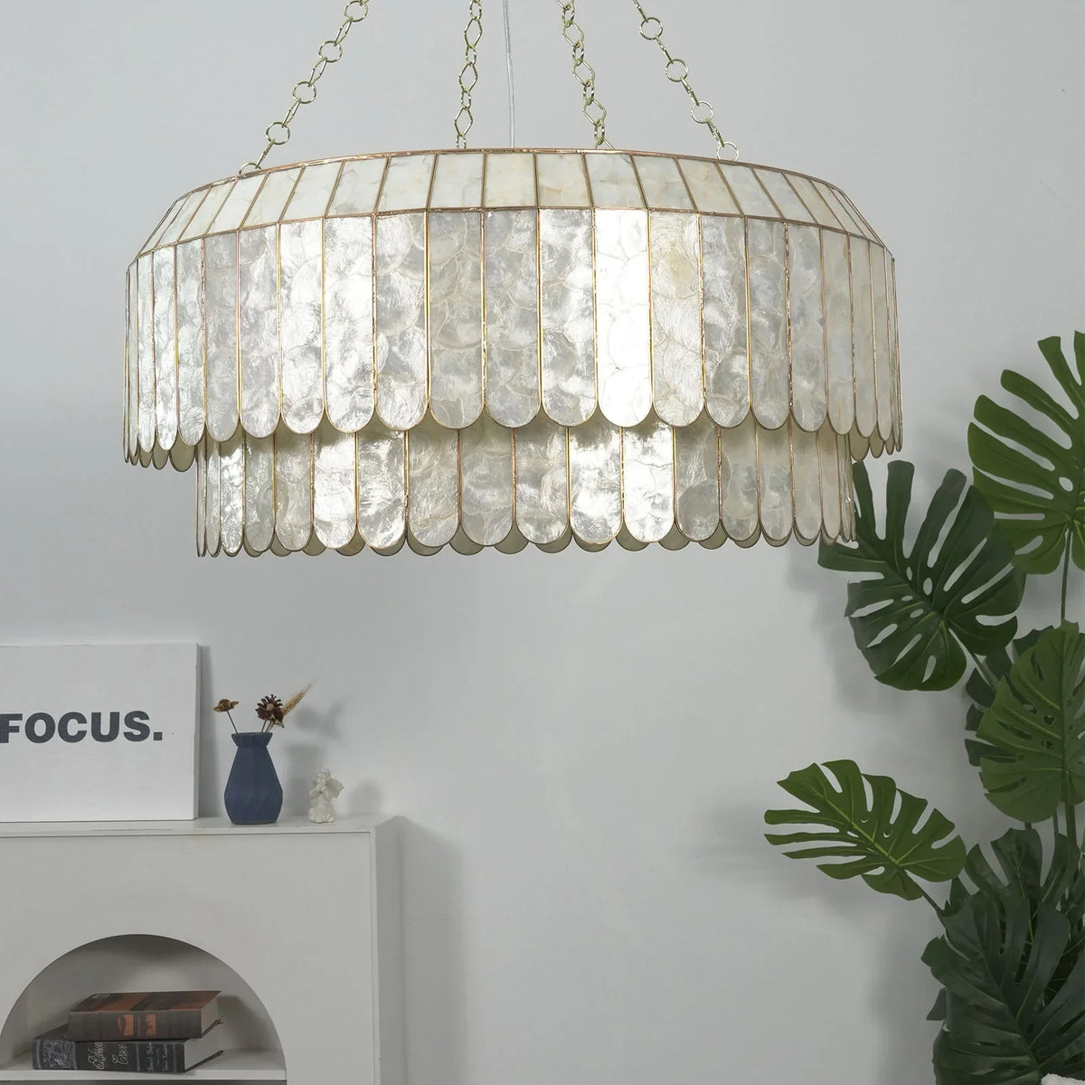 Light Luxury Shell Chandelier with silver-toned capiz shells, front view in a white room