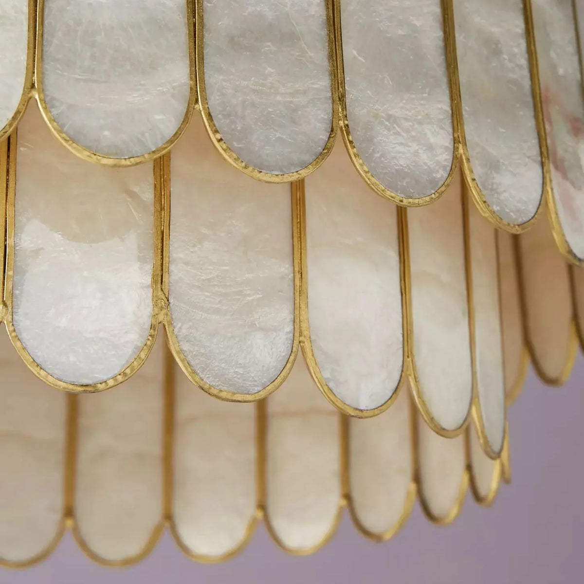 Close-up of the top gold frame and chain connection on the Light Luxury Shell Chandelier