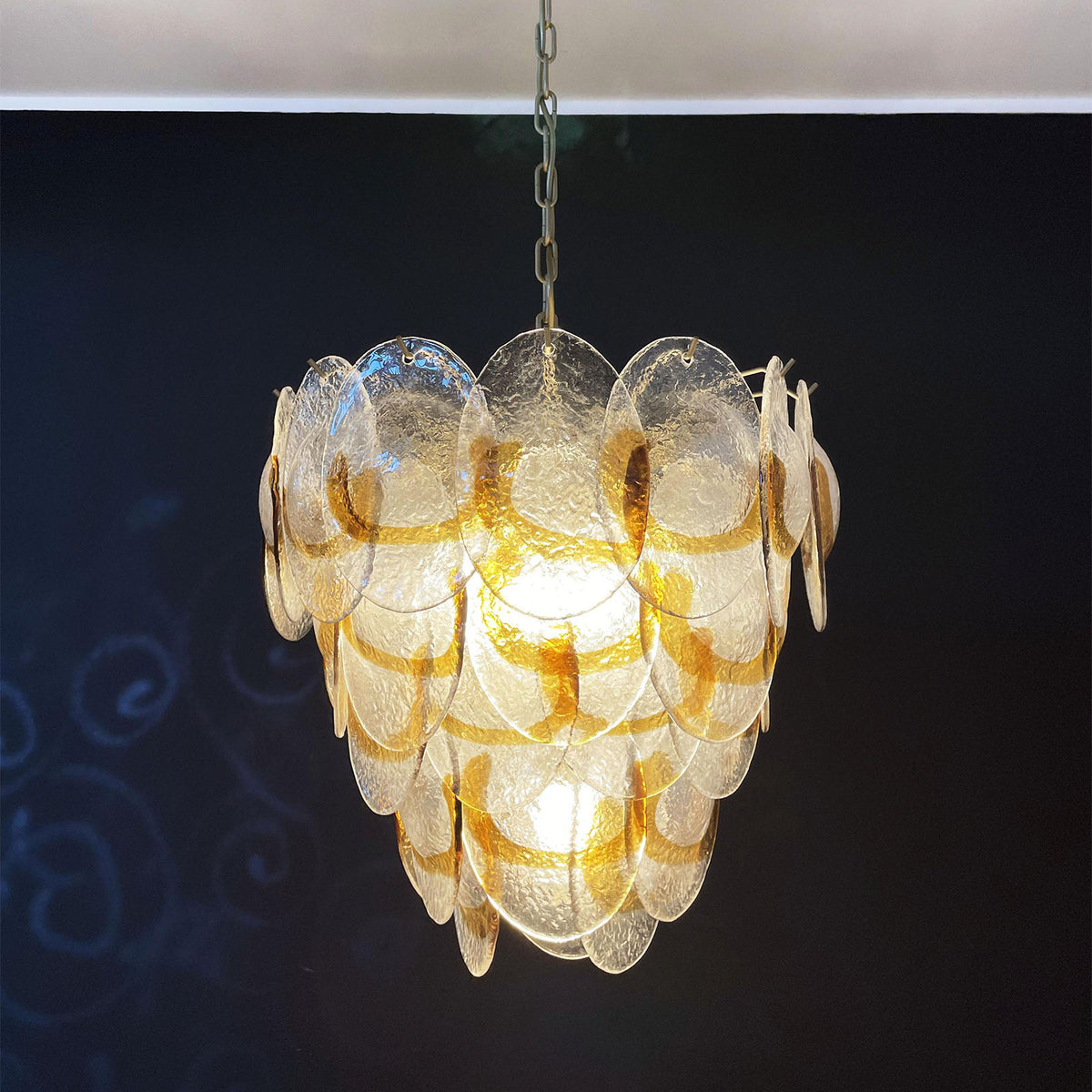 Top-down view of the Mazzega-style chandelier, showing its internal metal frame and glass disc arrangement.
