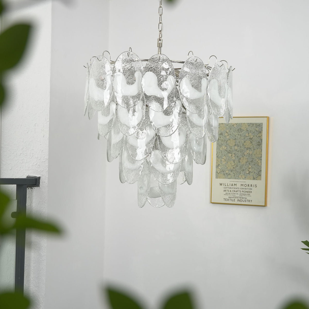Close-up of the translucent white glass discs on the lit Mazzega-style chandelier, showing light diffusing through.
