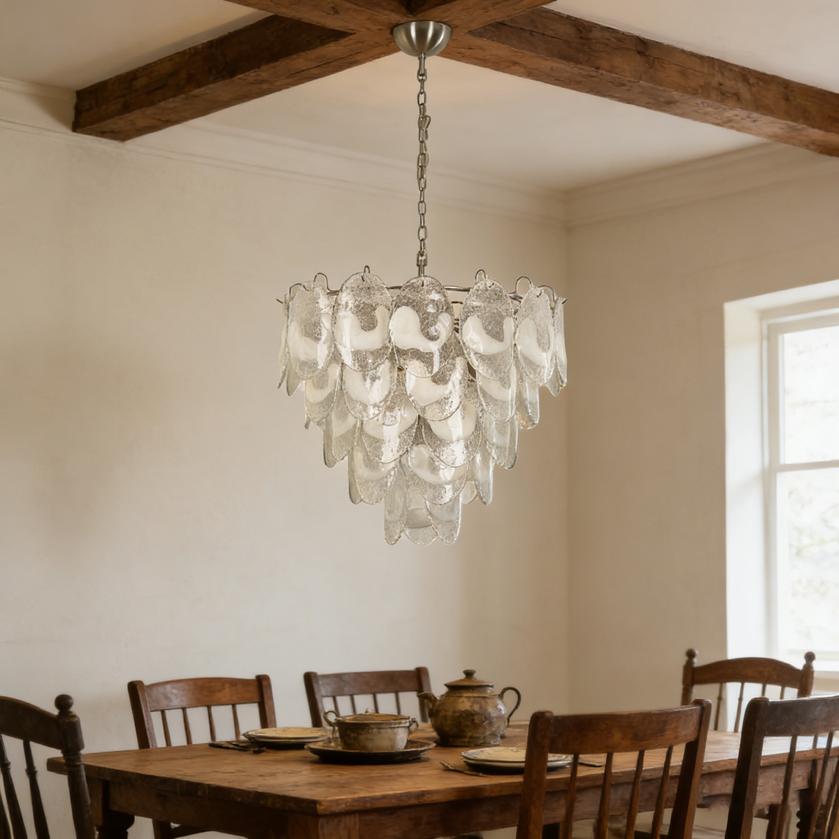 Mazzega-style white glass chandelier hanging in a vintage-style entryway with carved wooden furniture.