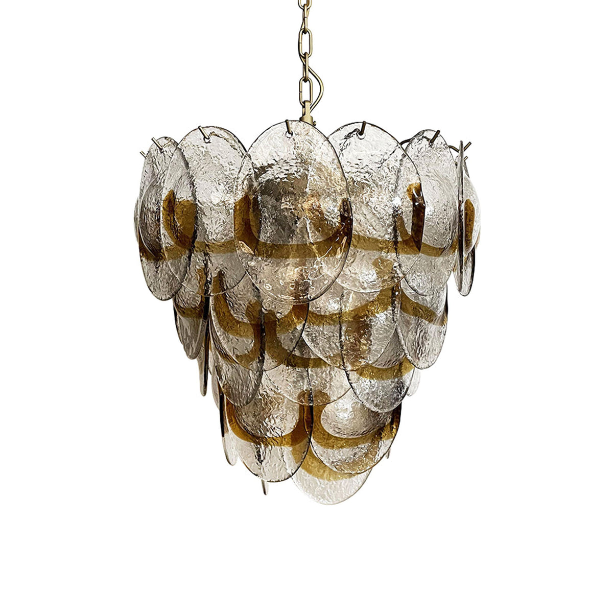 amber-glass-chandelier-isolated-metavaya Mazzega-style tiered chandelier with transparent glass discs and amber accents, isolated on a plain white background.