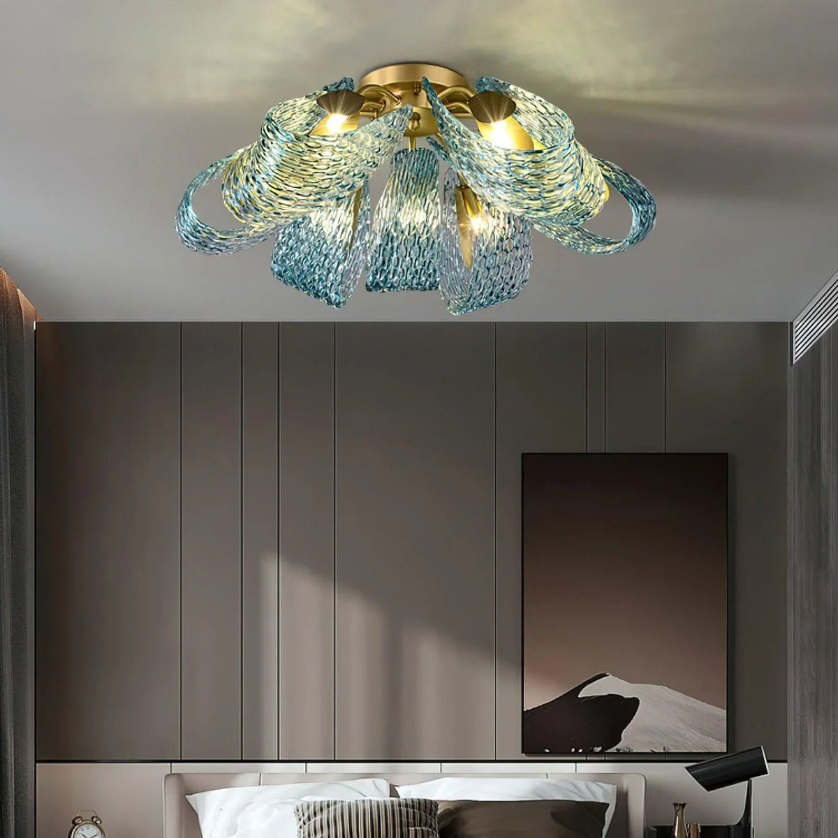 Petal blue glass ceiling light installed in a minimalist bedroom with dark accent walls.