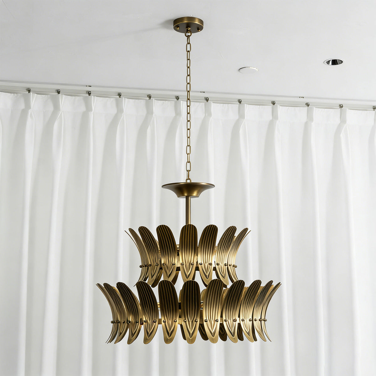 Vintage brass leaf chandelier showing the full hanging assembly with chain and ceiling mount.