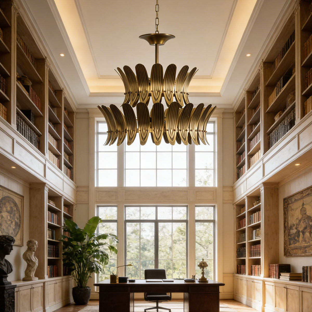 Vintage brass leaf chandelier centered in a bright home library with tall bookshelves.