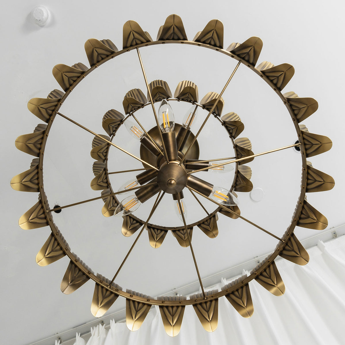 Top-down view of the vintage brass leaf chandelier showing its symmetrical radial design.