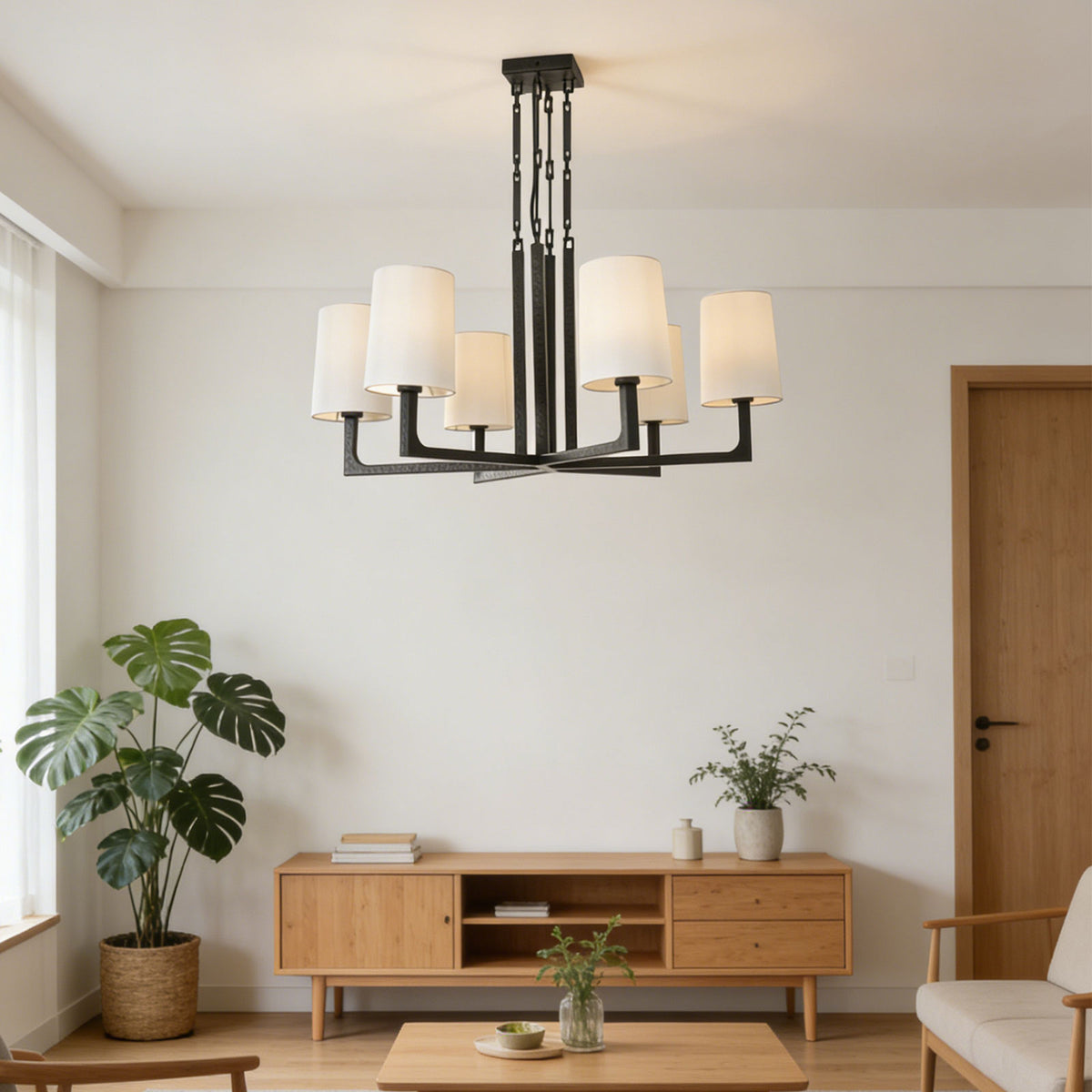 Wright-inspired round chandelier hanging in a cozy bohemian-style living room with light wood furniture.