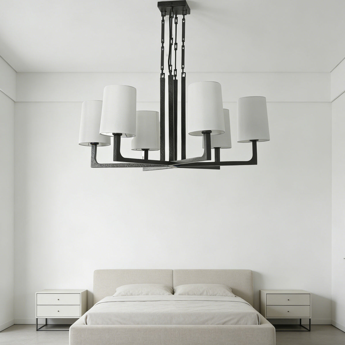 Wright-inspired round chandelier hanging in a bright entryway hallway with classic paneled walls.