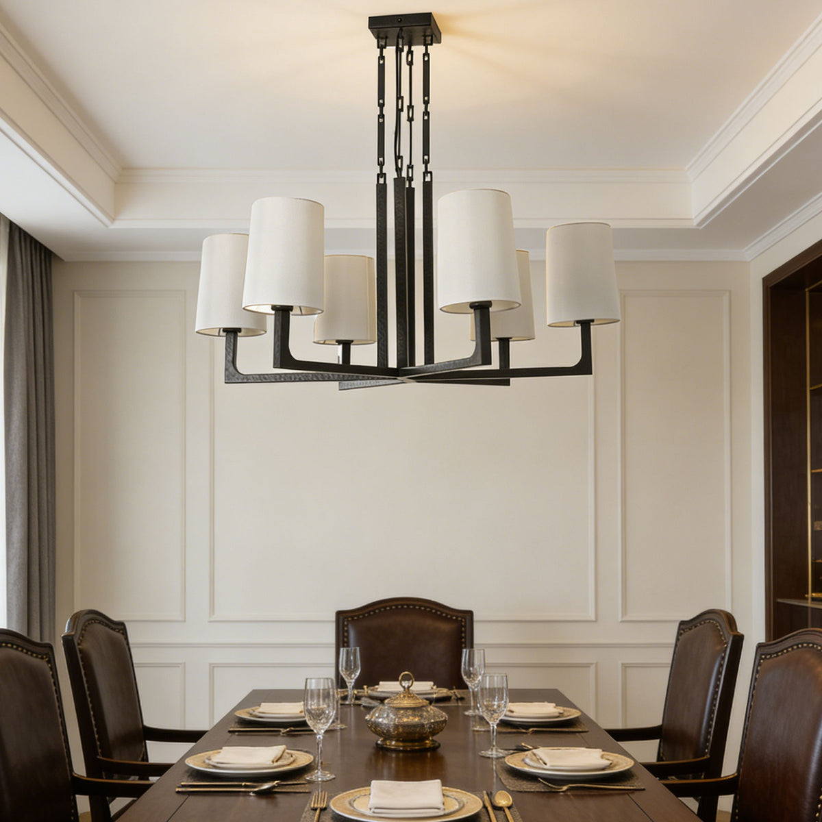 Wright-inspired round chandelier centered above a wooden dining table in a classic formal dining room.