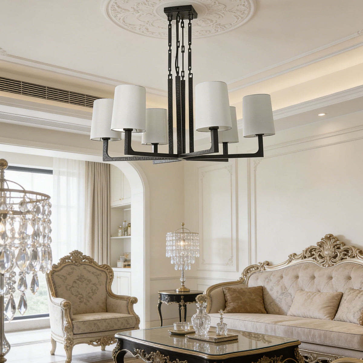 Wright-inspired round chandelier in a vintage-style living room with an ornate tufted sofa.