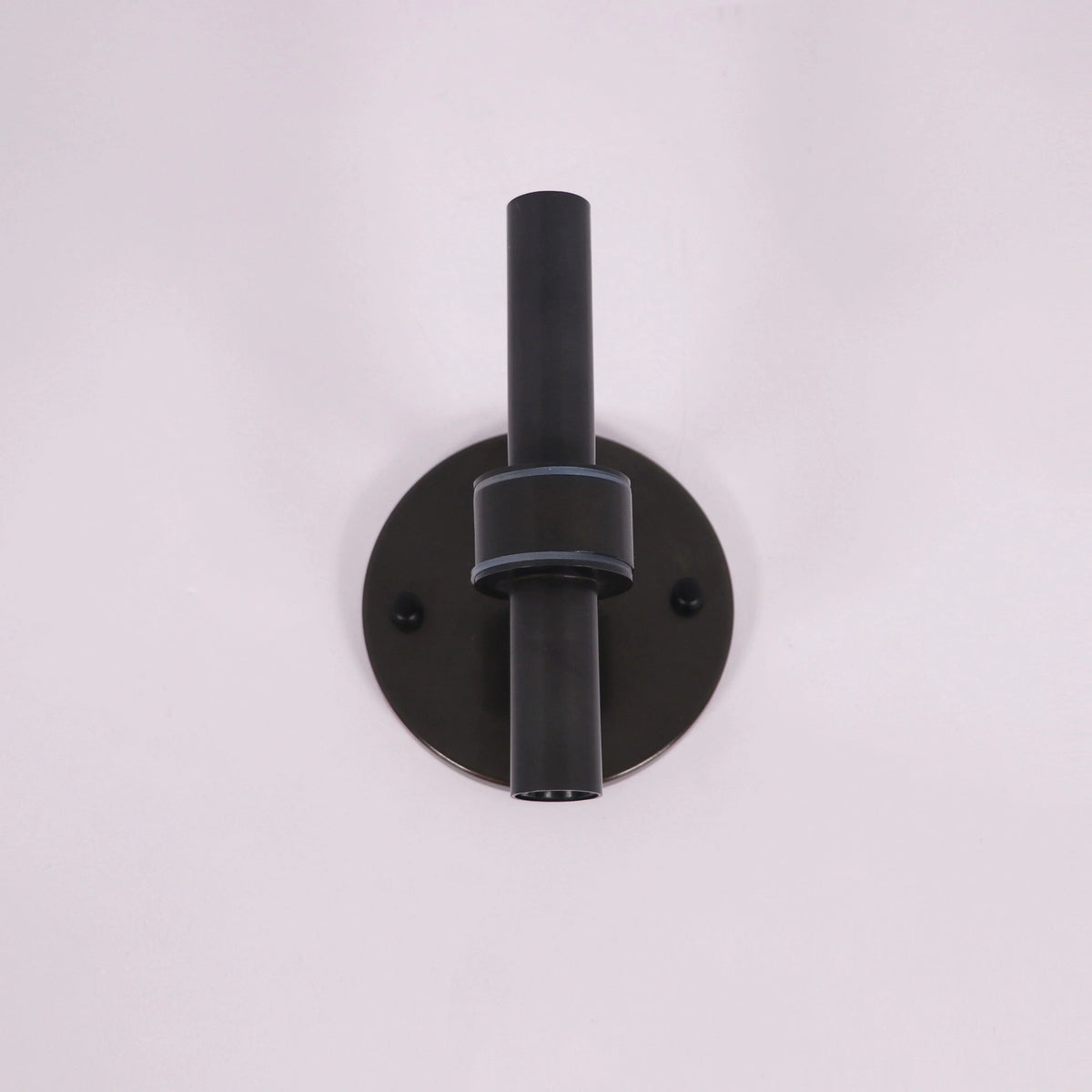 Modern black wall sconce with sleek cylindrical design for stylish home lighting