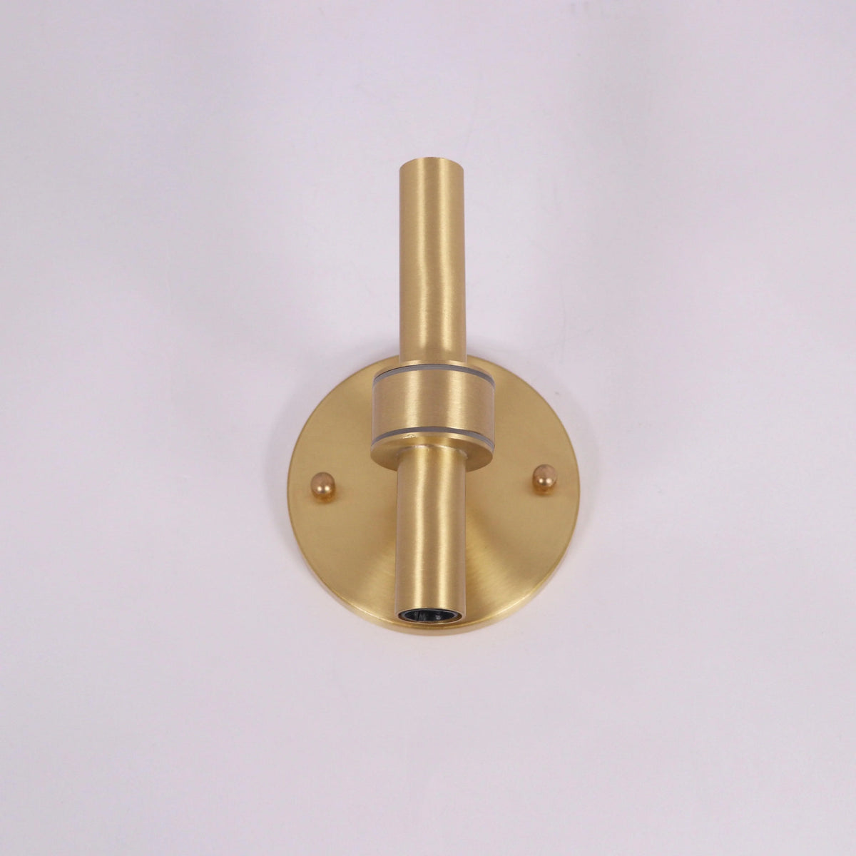 Modern gold wall sconce with sleek cylindrical design for stylish home lighting