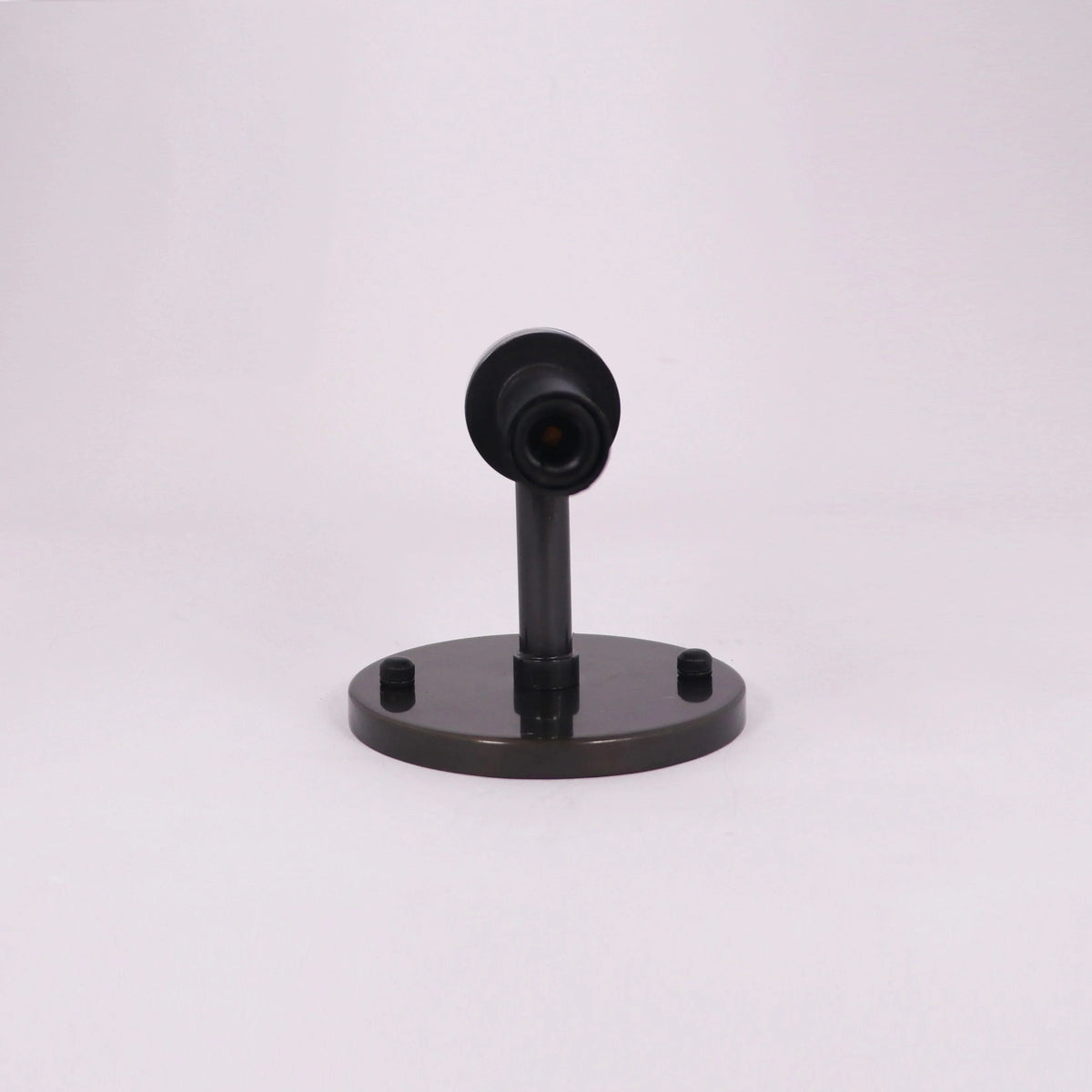 Modern black wall sconce with sleek design and circular base for contemporary lighting