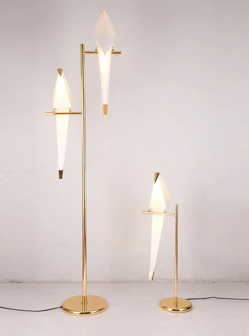 Modern gold floor and table lamps with white geometric shades, stylish contemporary lighting design