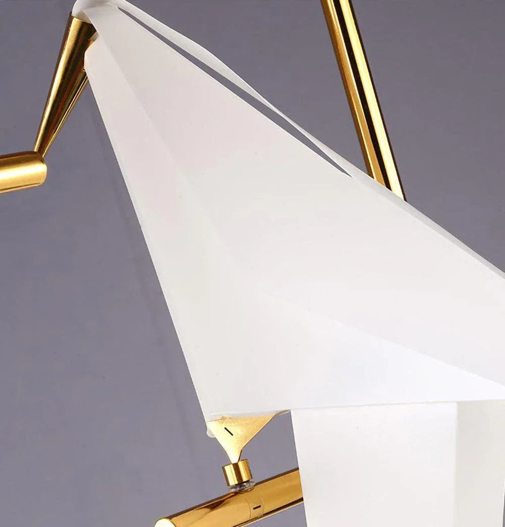 Modern gold and white geometric chandelier with sleek crystal accents for contemporary lighting