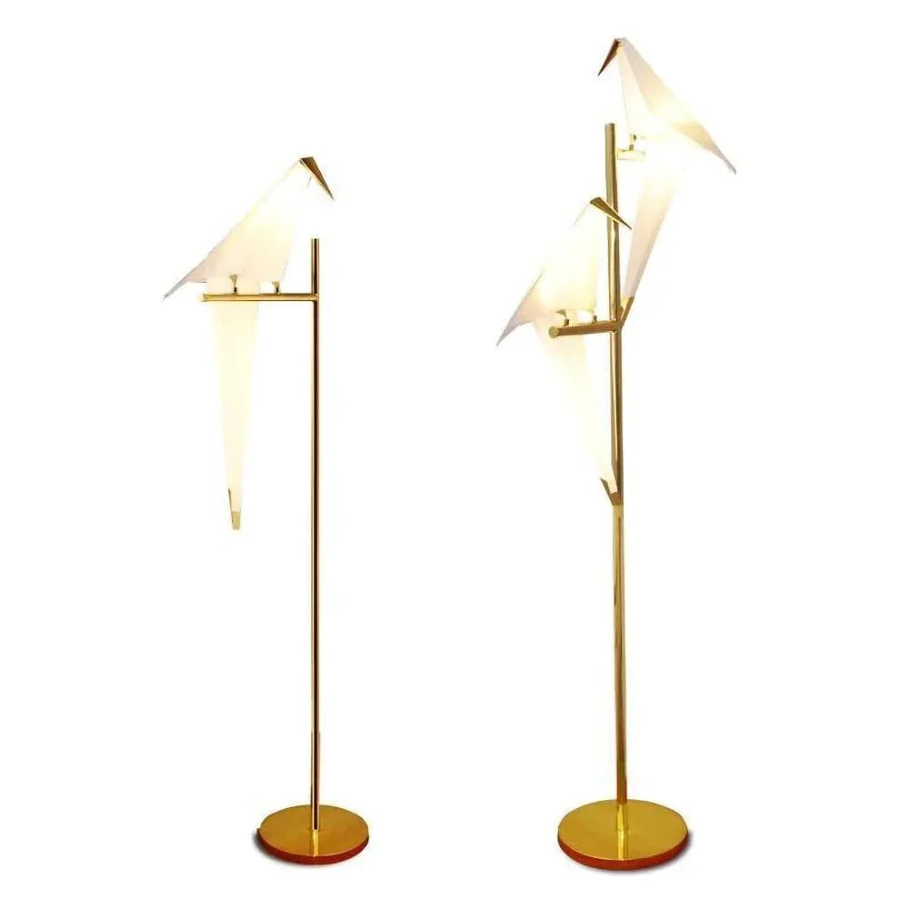 Modern gold floor lamps with bird-shaped white shades, stylish indoor lighting