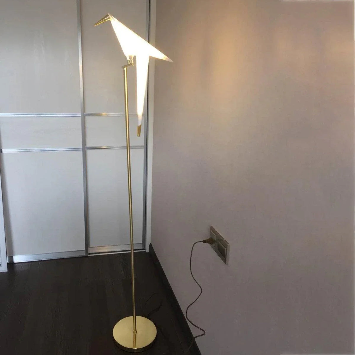 Modern gold floor lamp with bird-shaped shade, stylish indoor lighting for living room or bedroom